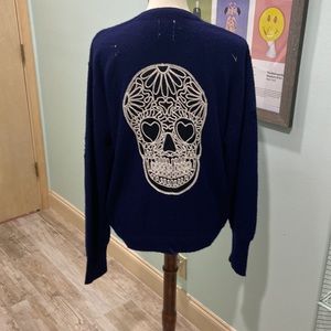 Edgy as hell! One of a kind- distressed vintage golf sweater/ skull on the back.